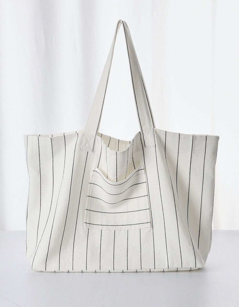 Side profile minimalist striped tote shoulder bag