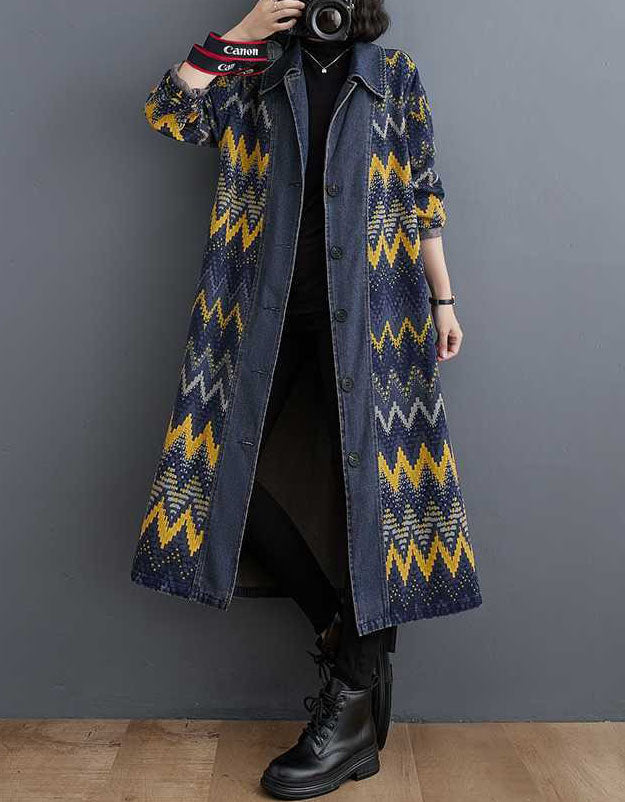 Full body view of denim coat with yellow and blue zigzag pattern
