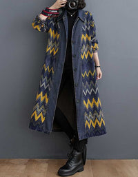 Full body view of denim coat with yellow and blue zigzag pattern