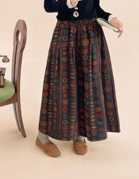 Elastic waistband and pleat detail on coffee polka dot midi skirt