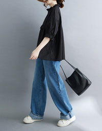 Black oversized blouse with gathered ruffle