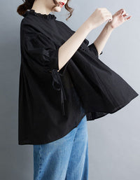 Soft black blouse minimalist style