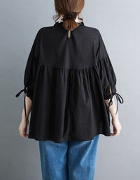 Women’s casual black loose fit top back view