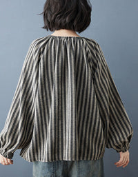 Back view of women’s casual linen button-up top with vertical stripes