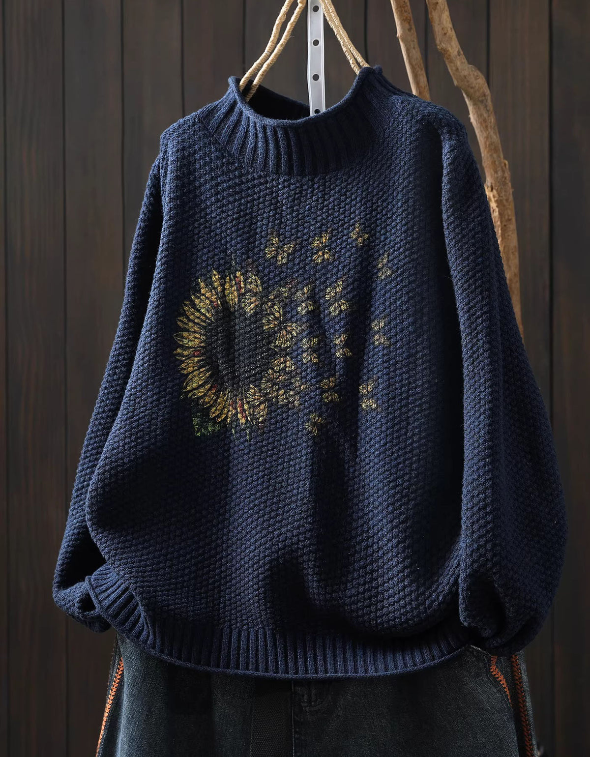 Cozy autumn sunflower knit pullover hanging display navy