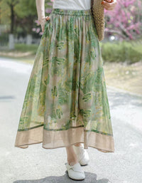 Lightweight bohemian maxi skirt paired with casual summer top and woven handbag