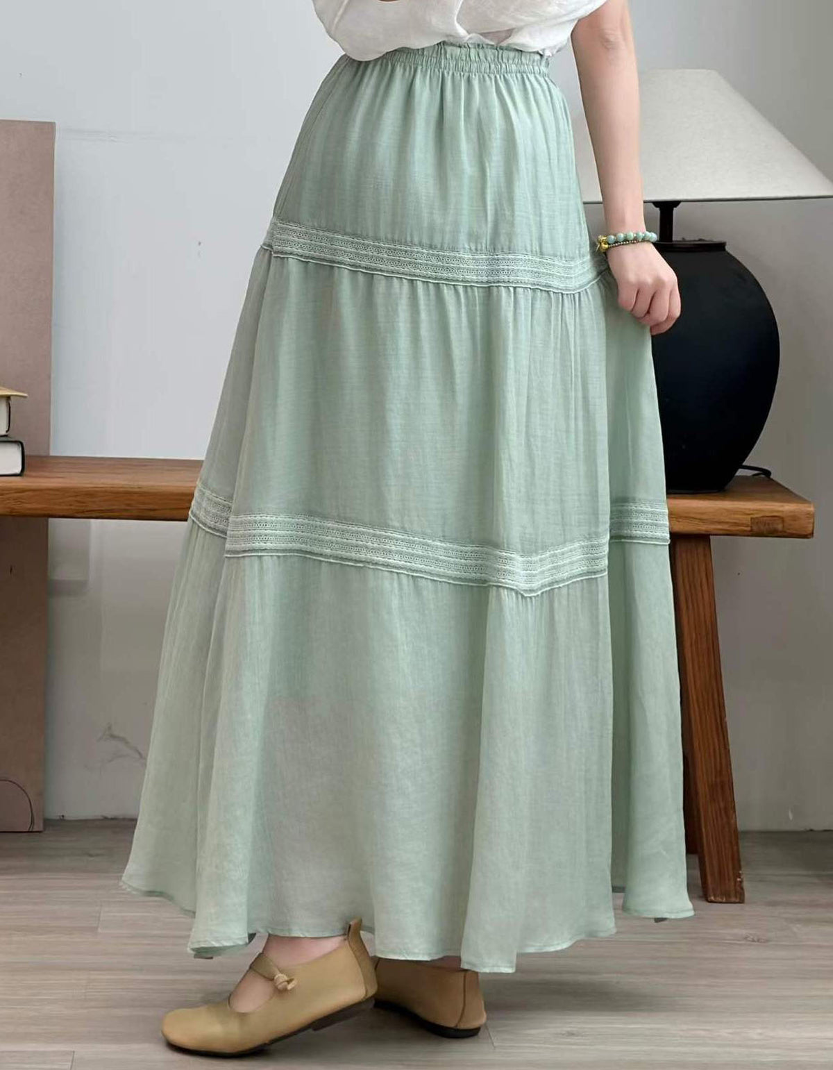Women green tiered maxi skirt drawstring waist front view