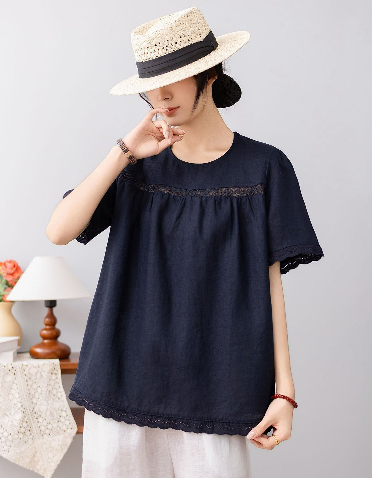 Round neck linen blouse with scalloped sleeve detail