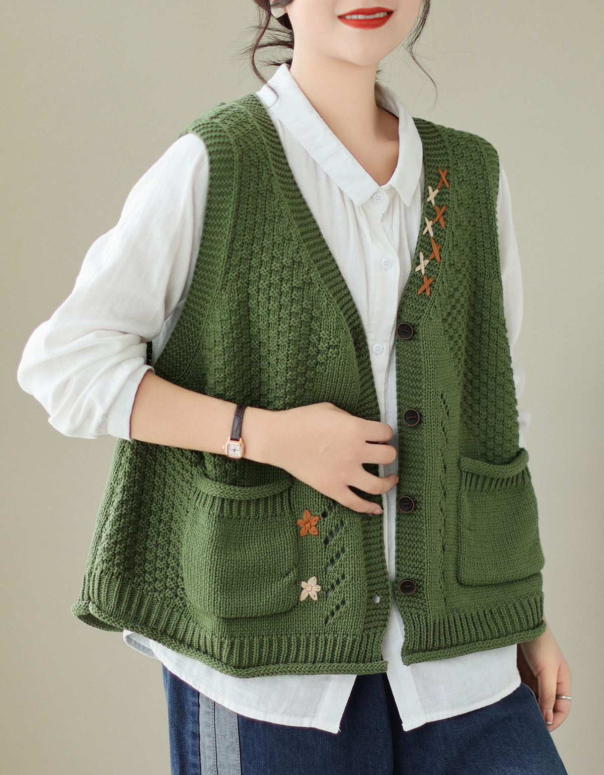 Women wearing green knitted vest with embroidery