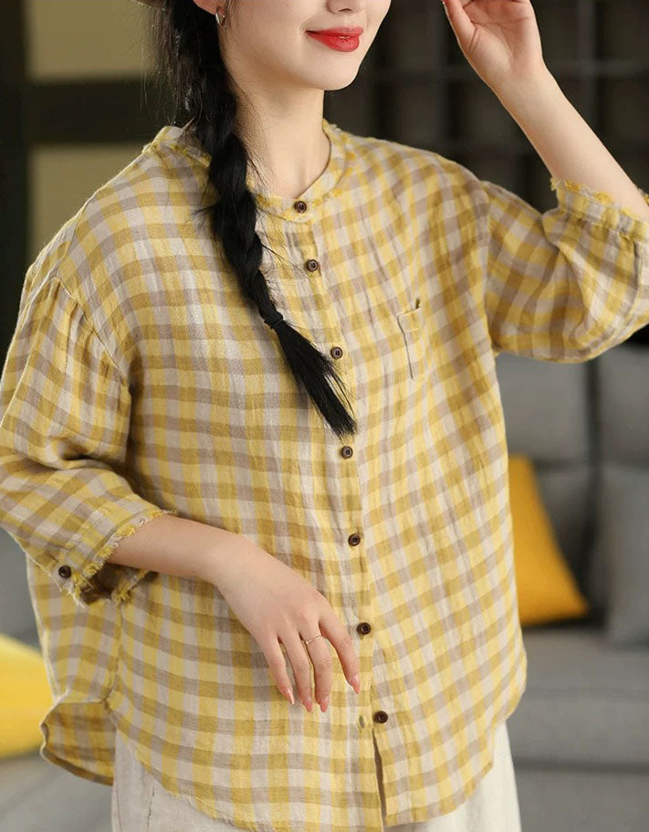 Front view of women’s yellow checkered cotton shirt with button-down closure