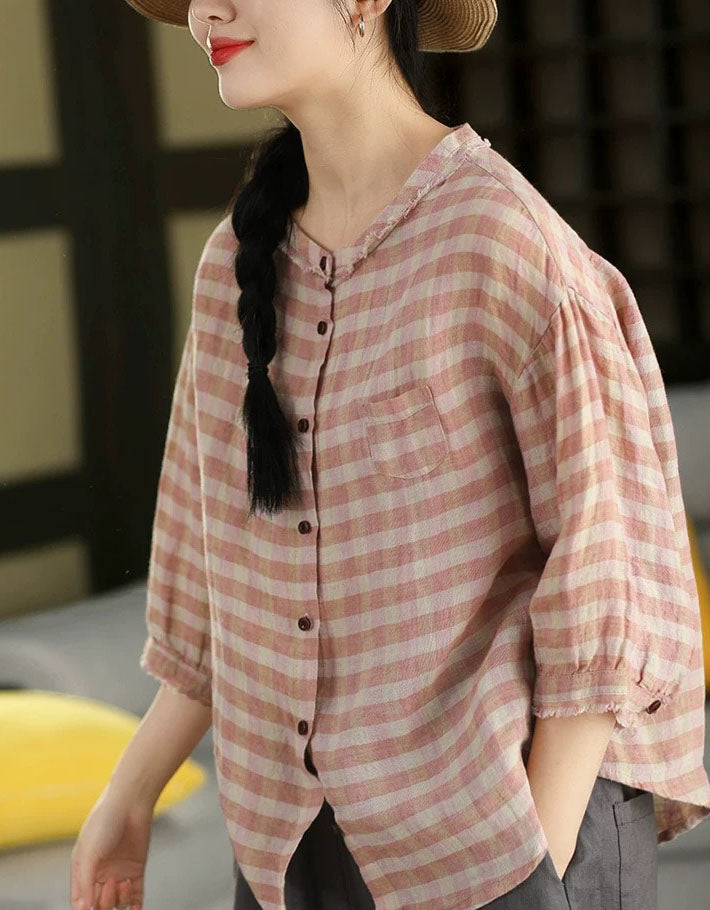 Front view of women’s pink checkered cotton shirt with button-down closure