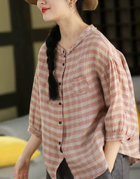 Front view of women’s pink checkered cotton shirt with button-down closure