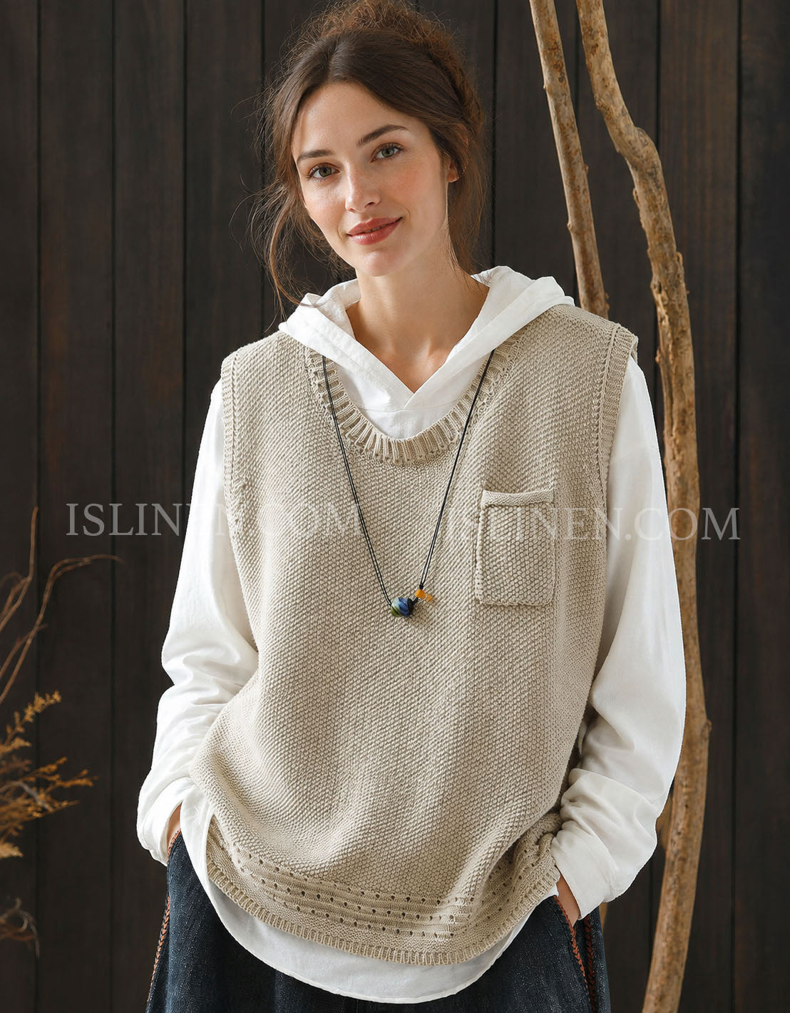 Women's beige textured knit sweater vest with V-neck over white shirt