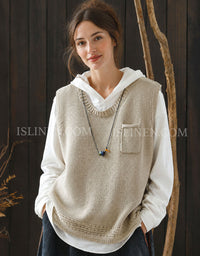 Women's beige textured knit sweater vest with V-neck over white shirt