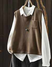 Women's camel V-neck knit sweater vest layered over white blouse