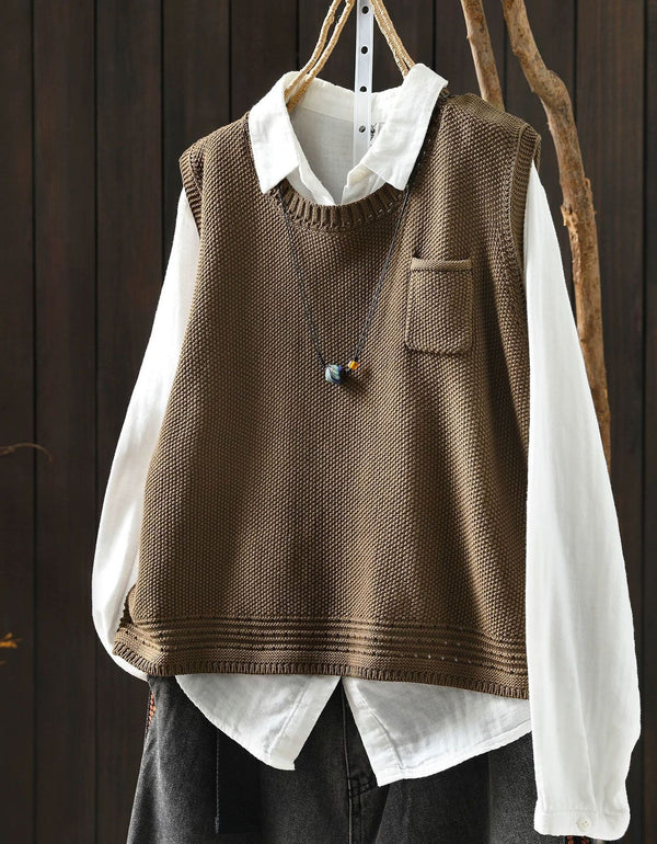 Women's camel V-neck knit sweater vest layered over white blouse