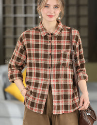 Women’s brown plaid button-up shirt with relaxed oversized fit, long sleeves and chest pocket