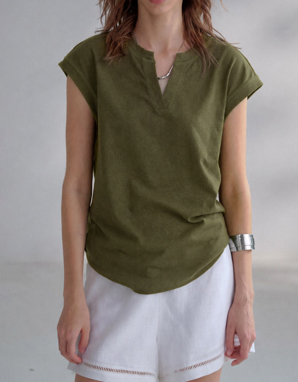 Summer linen top layered with white pants and accessories