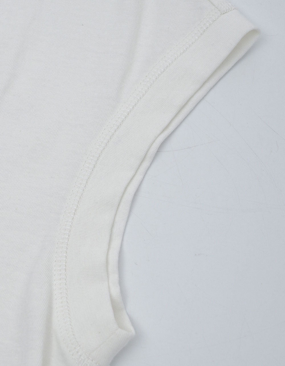 Front view of white sleeveless linen top for women