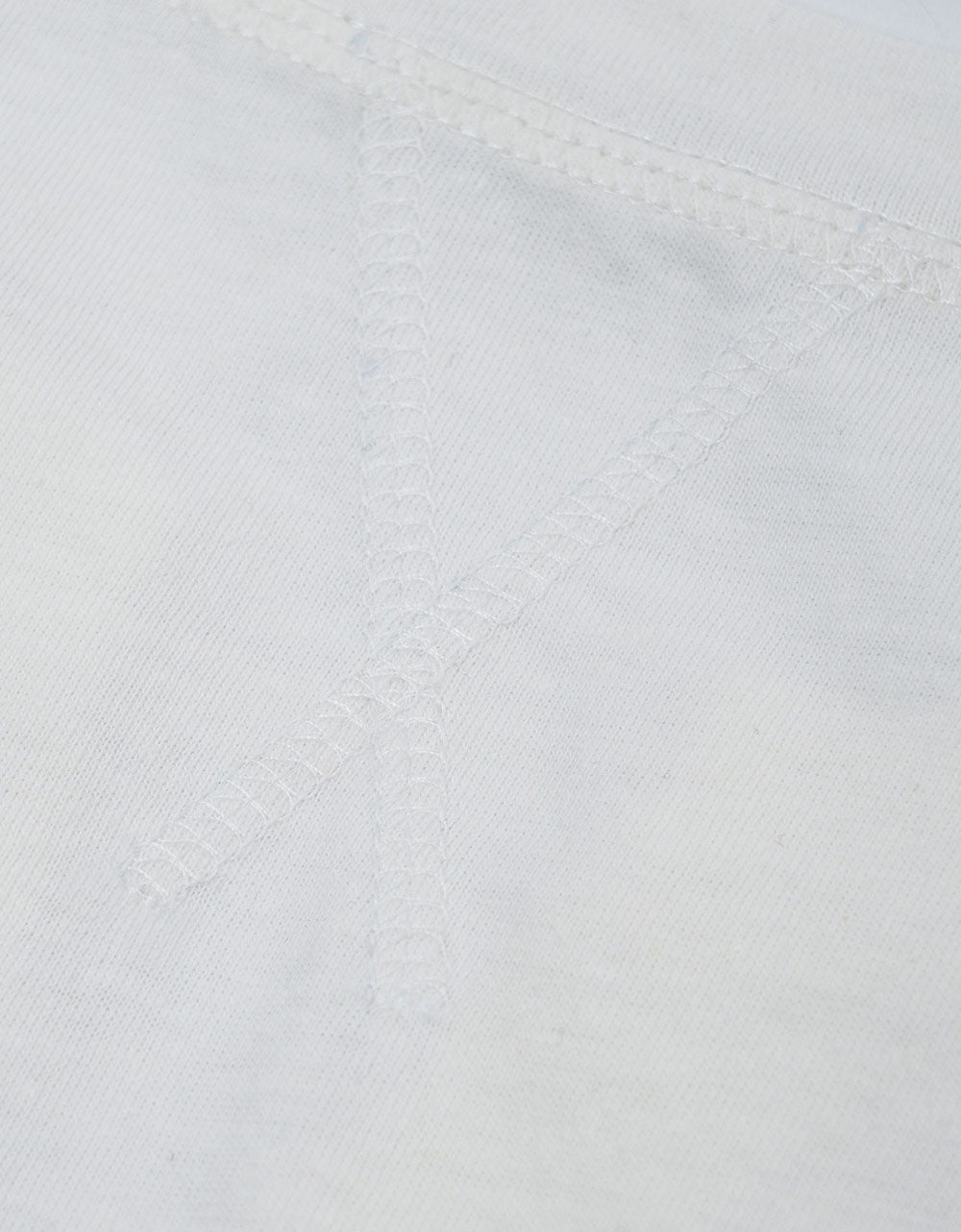 Close-up of fabric texture and neckline of sleeveless top