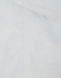 Close-up of fabric texture and neckline of sleeveless top