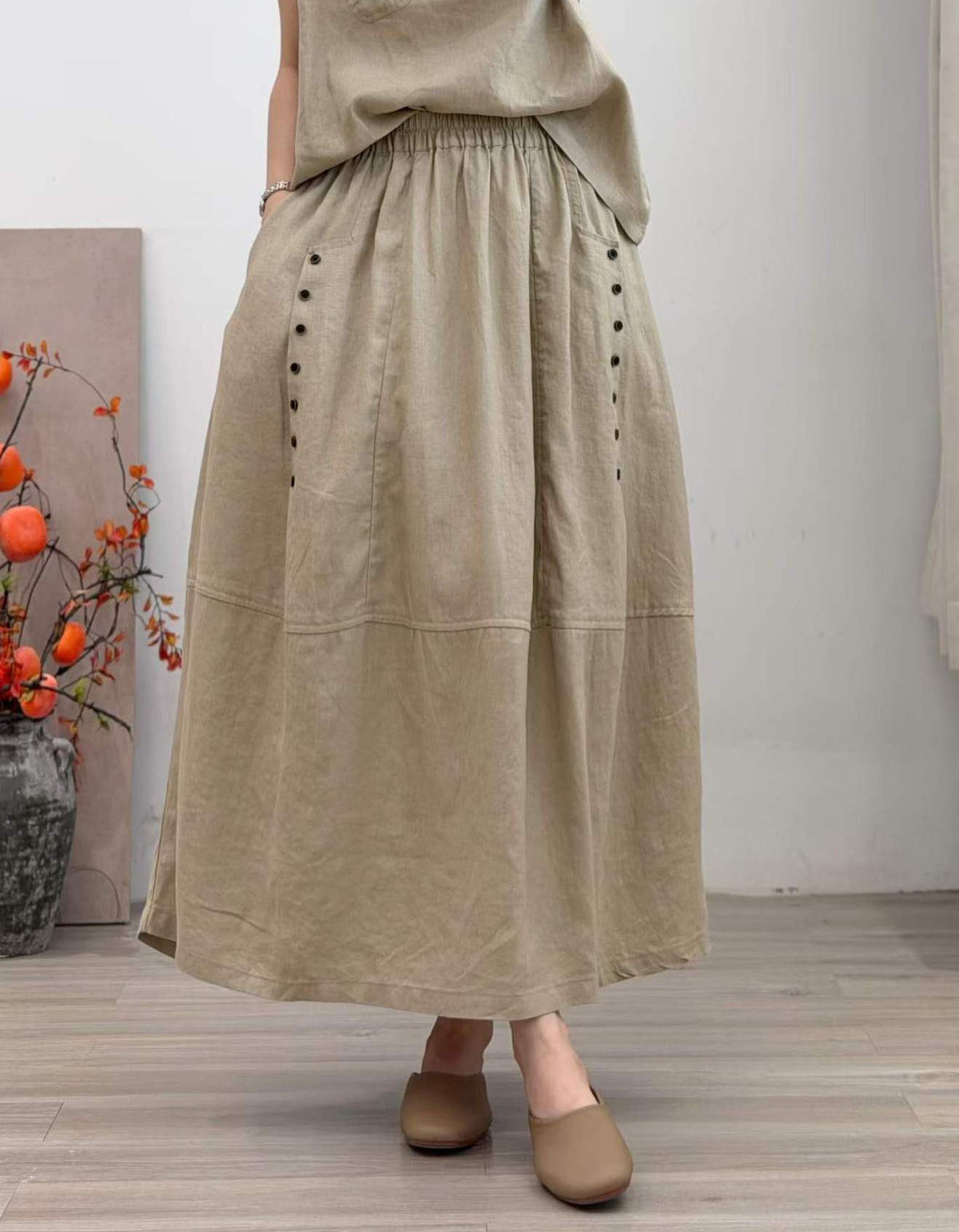 Women's casual long linen skirt featuring a relaxed fit and practical pockets
