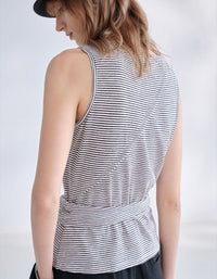 Minimalist striped knit camisole for women paired with black wide leg pants
