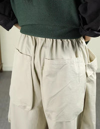 Back view of women’s yellow wide-leg cotton pants with drawstring