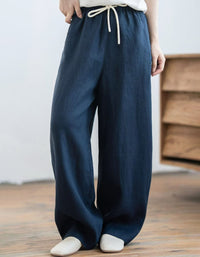 Lightweight summer linen pants in mustard yellow with relaxed fit and breathable natural fabric