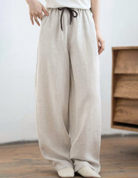 Casual linen palazzo trousers for women featuring wide leg design, side pockets and adjustable drawstring waistband