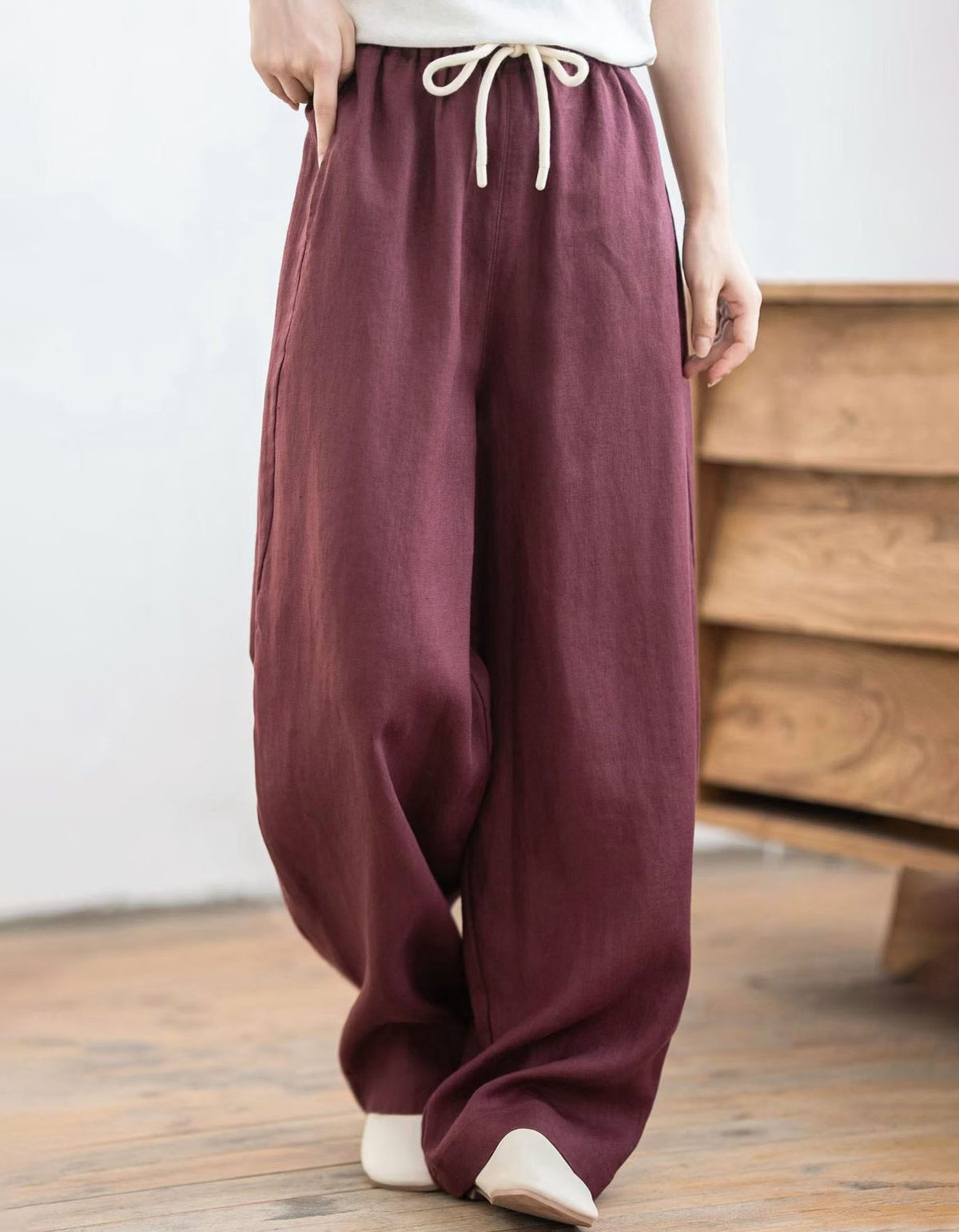 Women's resort wear linen palazzo pants featuring elastic waist, loose fit and lightweight construction