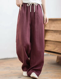 Women's resort wear linen palazzo pants featuring elastic waist, loose fit and lightweight construction