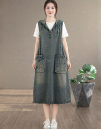 Front view of women’s loose denim hoodie dress with hood and pockets