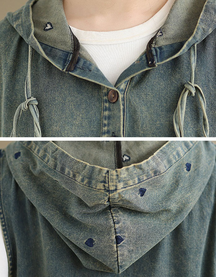 Close-up of front pockets and distressed denim detail on hoodie dress