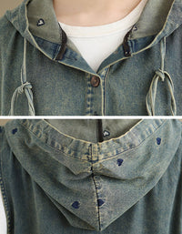 Close-up of front pockets and distressed denim detail on hoodie dress