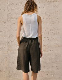 Front view of breathable wide-leg linen shorts with pockets