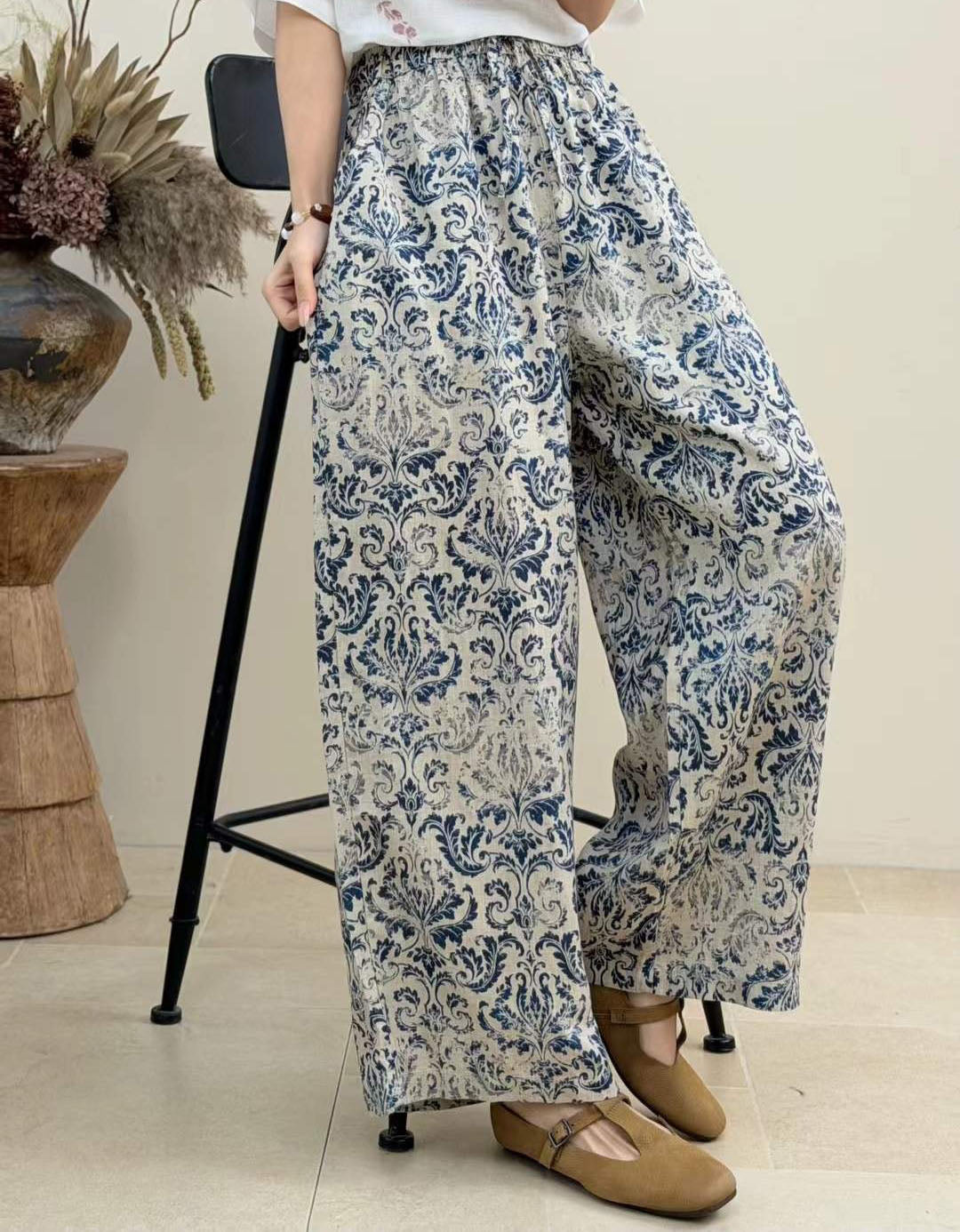 Woman styling boho striped wide leg pants for casual summer and vacation outfit