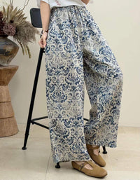 Woman styling boho striped wide leg pants for casual summer and vacation outfit