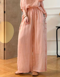 Women’s pink linen wide leg pants with floral embroidery and elastic waist