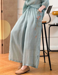 Loose fit blush pink linen pants styled with matching embroidered blouse