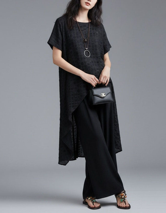 Front view of women's black asymmetrical check dress