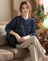 Casual loose fit denim blouse styled for everyday wear and layering