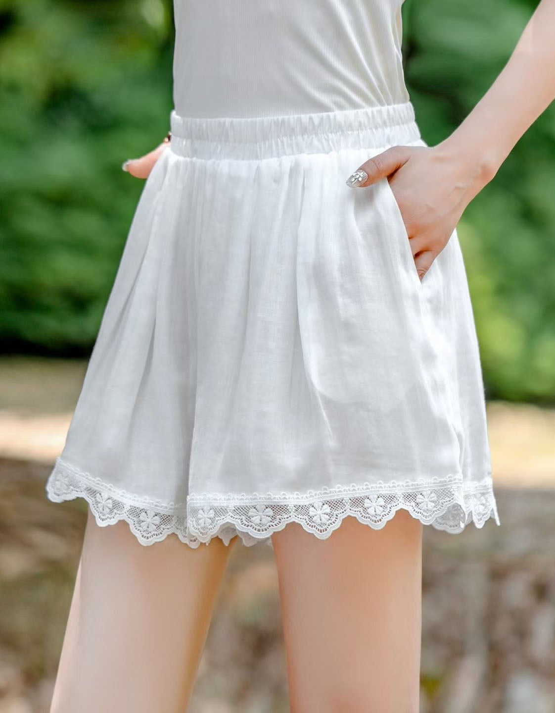 Soft pastel pink casual summer shorts for women with crochet lace detailing