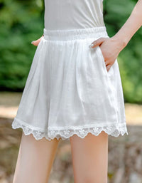 Soft pastel pink casual summer shorts for women with crochet lace detailing