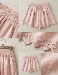 Elegant Korean style pink shorts with floral lace hem and relaxed silhouette
