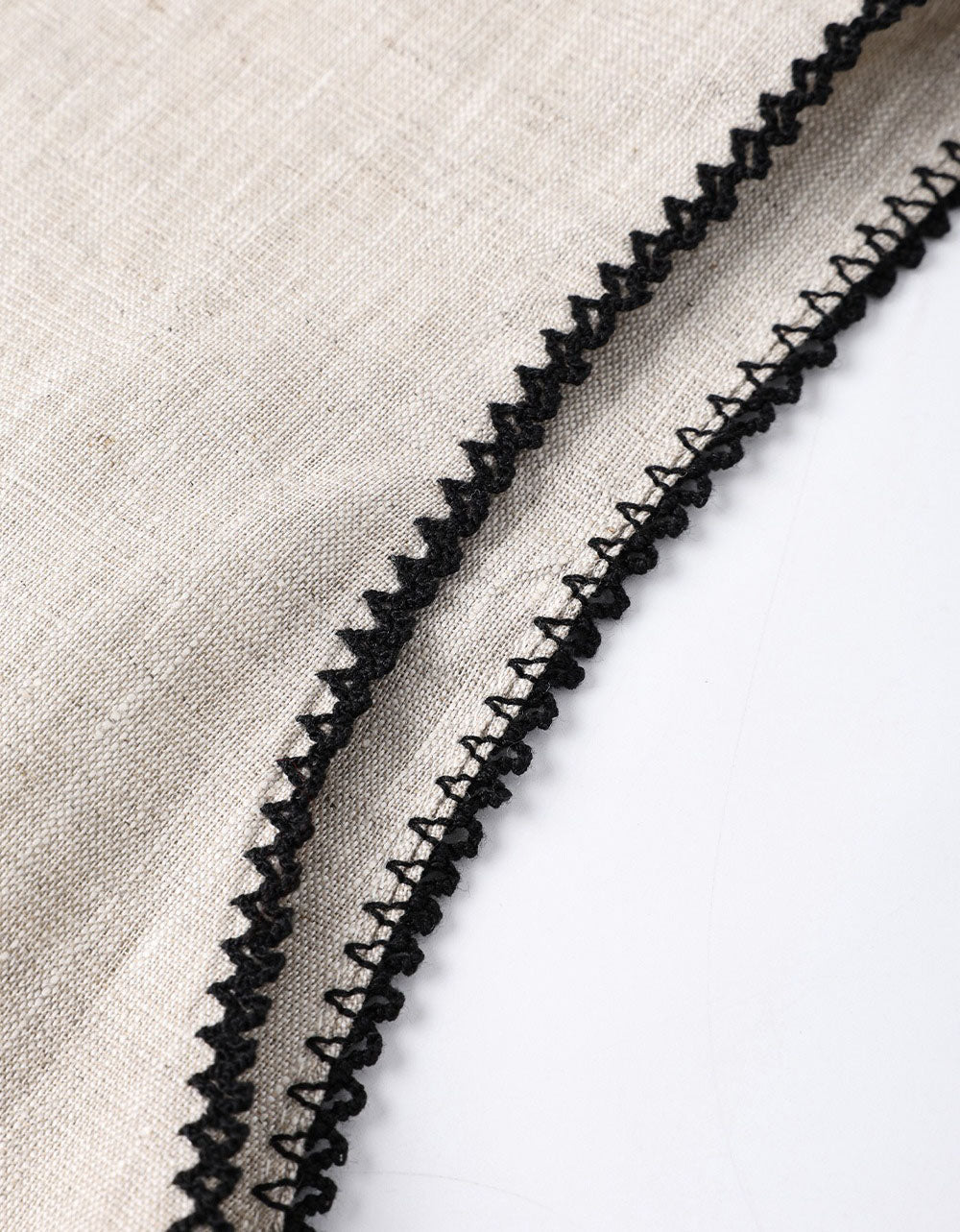 Women’s relaxed fit sleeveless linen top close-up detail