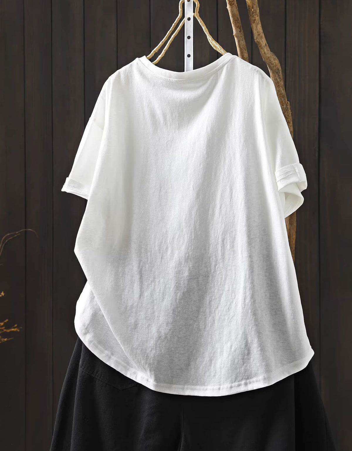 Back view of oversized white women’s tee styled for relaxed everyday wear