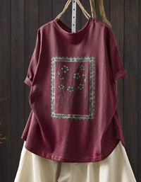 Front view of red oversized floral graphic t-shirt with vintage botanical print

