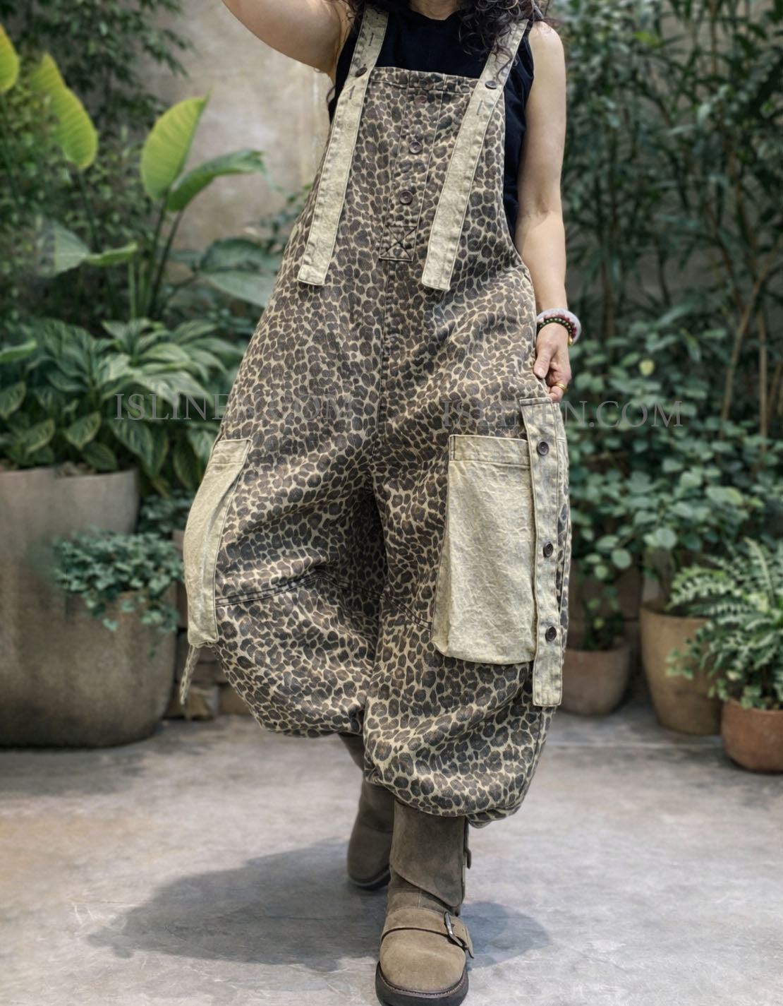 Side view of wide leg leopard jumpsuit pants with adjustable straps