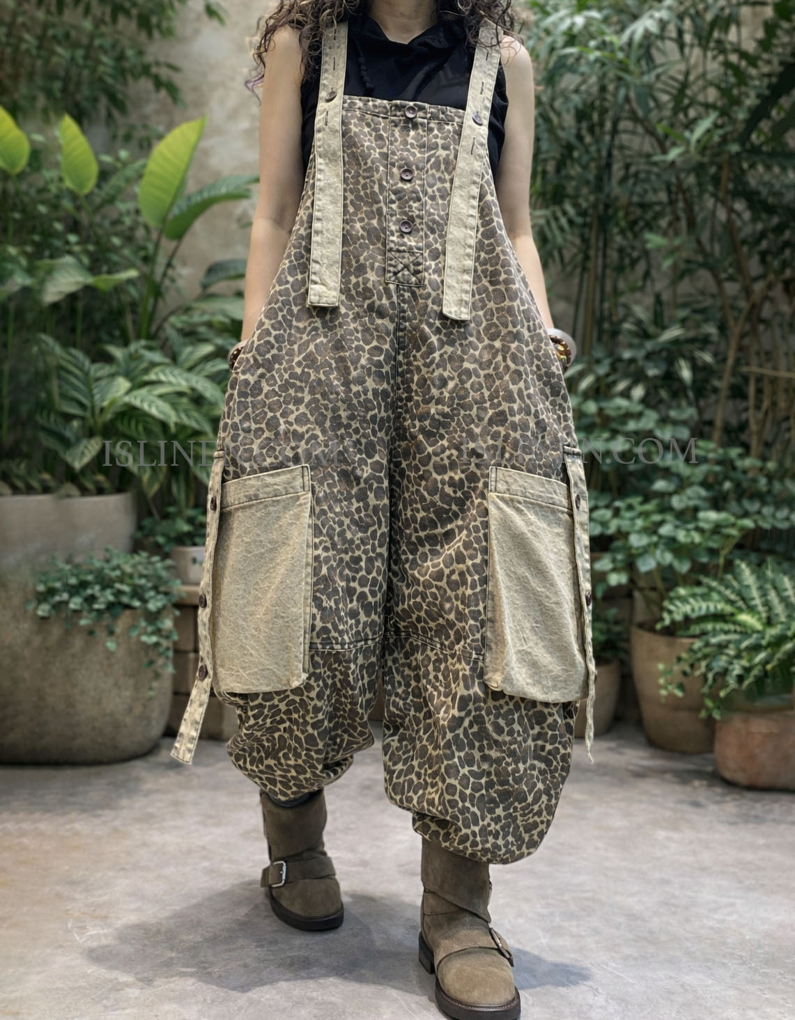 Front View of oversized cargo pockets on women’s leopard dungarees